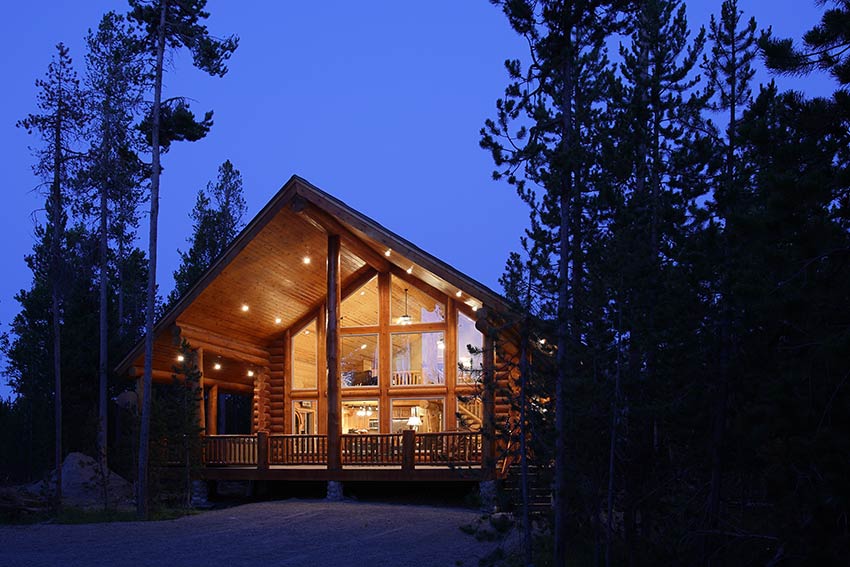 luxury cabin at dusk with lights on